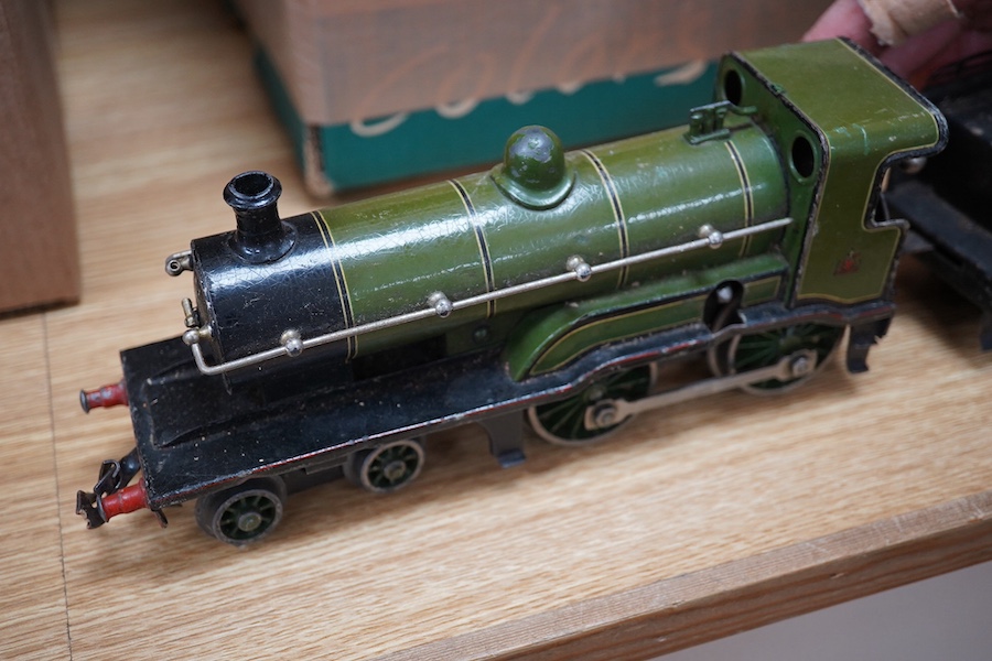 A Bing for Bassett Lowke 0 gauge tinplate clockwork LNER Ivatt 4-4-0 tender locomotive, 4390, together with an early Hornby clockwork 0-4-0, 2710, in GNR green livery with Meccano Ltd roundels to locomotive splasher and
